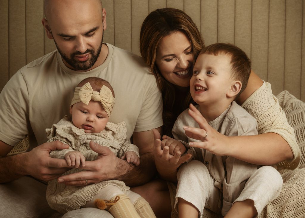 in home natural baby and family photo enjoying time together in natural photos smiling holding hands Sutton Carshalton Wallington Croydon Cheam photography