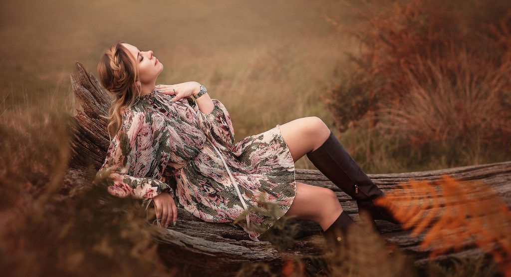 Personal Creative Portrait Women laying on the log outdoors natural photo taken in the park Sutton Surrey London Photographer