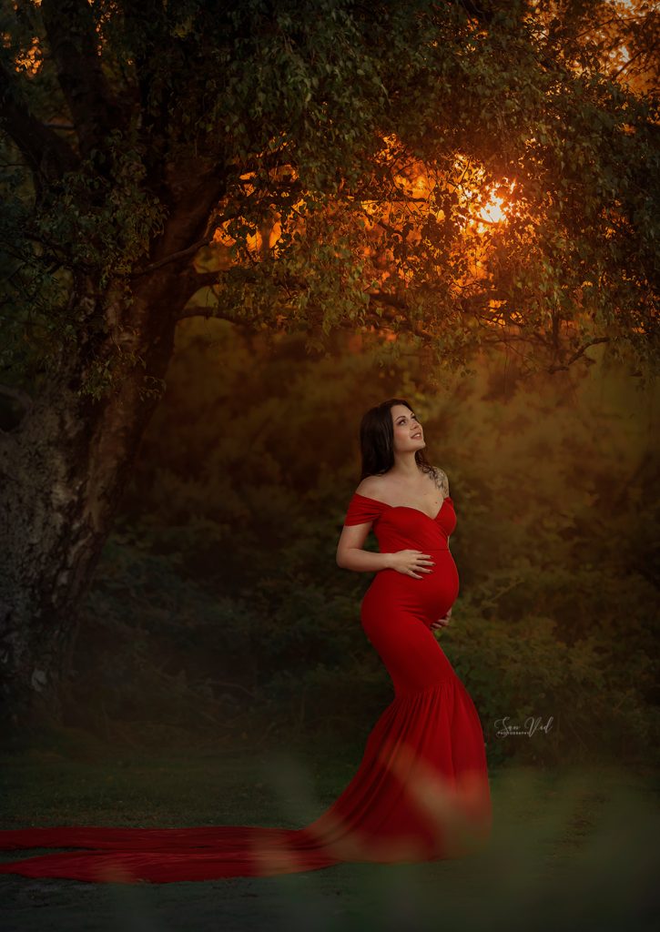 pregnant lady wearing long red fishtaip dress golden light photo in Purley Wallington Sutton