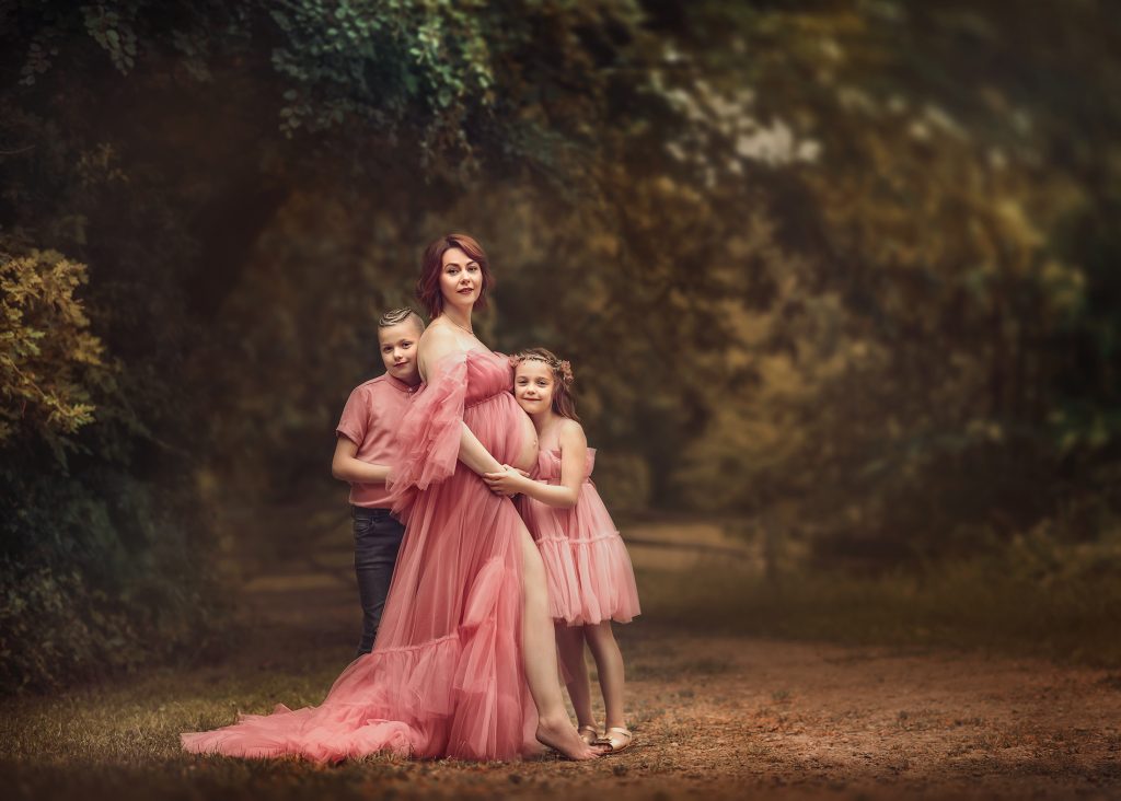 Coordinated outfits for family maternity photos with parents and children Surrey pregnancy family photoshoot