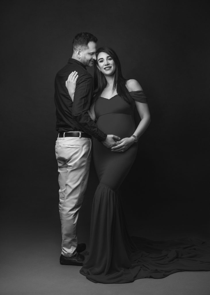 Natural maternity photos with partner during pregnancy photoshoot in Surrey studio